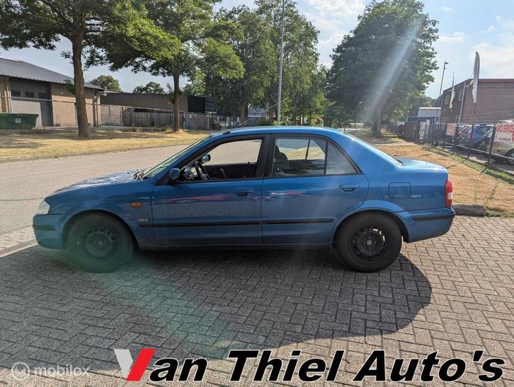 Mazda 323 1.5i GLX ijskoude airco sedan el.ramen, Auto's, Mazda, Bedrijf, Te koop, Airconditioning, Alarm, Centrale vergrendeling