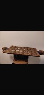 Afrikaans houten spel, Ophalen