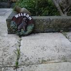 Welkoms bord met Duitse herder, Ophalen