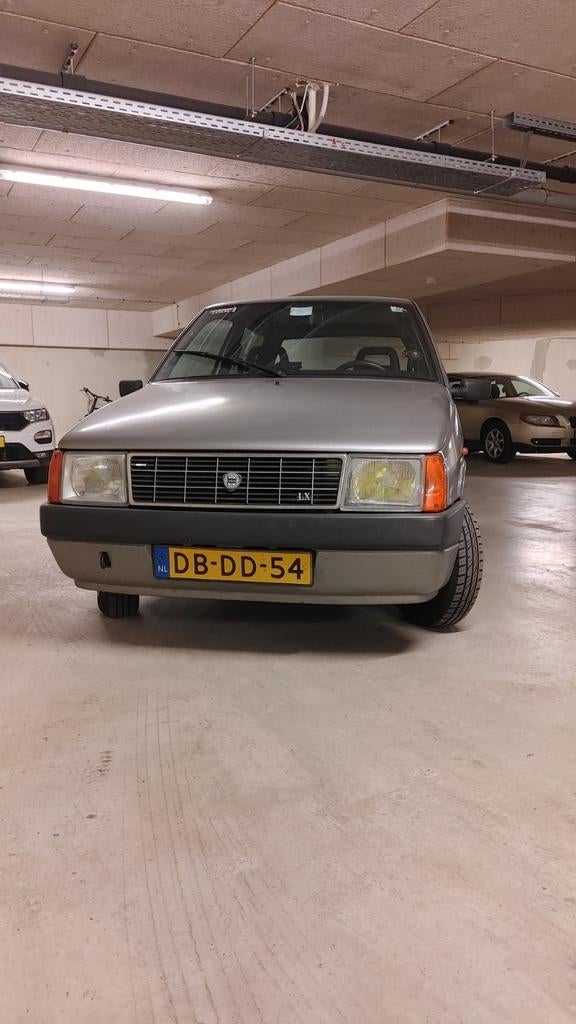 Lancia Y10 1.1 Selectronic AUT U9 1991 Grijs, Auto's, Lancia, Stof, 4 cilinders, 900 kg, 1108 cc