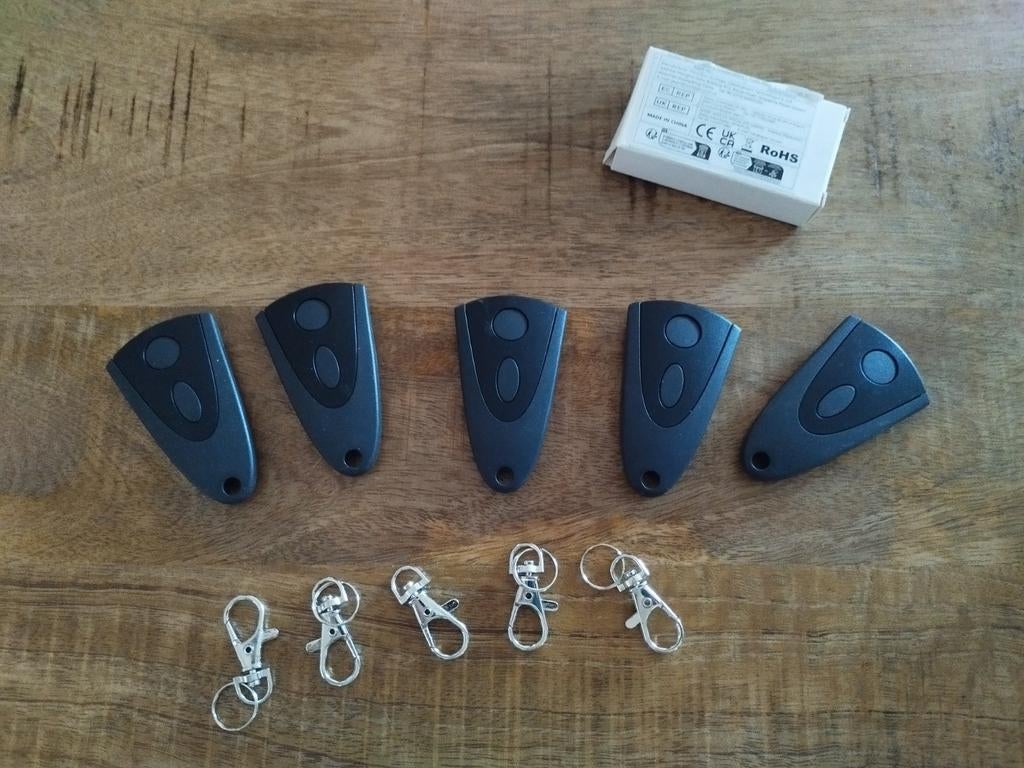 Nieuwe Novoferm Garagedeur Afstandsbediening (2 stuks), Ophalen of Verzenden