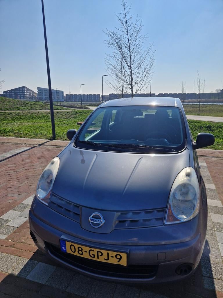 Nissan Note 1.4 16V 2009 Blauw, Auto's, Nissan, Voorwielaandrijving, Stof, 4 cilinders, Blauw