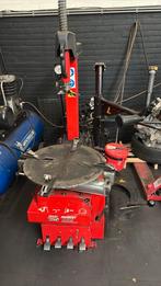 Banden wisselaar met hulp arm, Ophalen