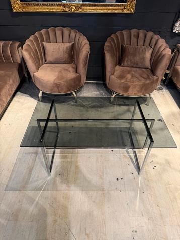 Luxe salontafel doorzichtig met zilver pootjes beschikbaar voor biedingen