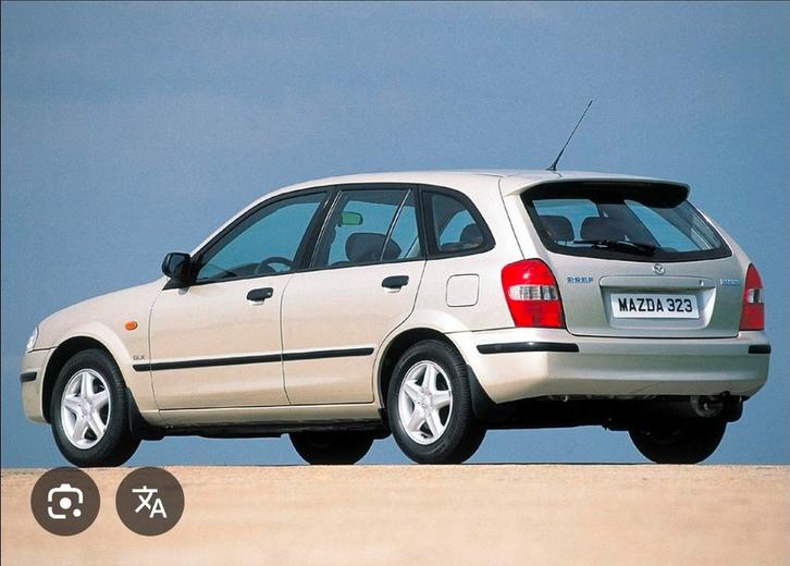 Gezocht: Mazda 323F BJ schaalmodel, Hobby en Vrije tijd, Modelauto's | 1:18, Auto, Overige merken, Ophalen of Verzenden