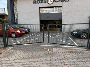 Hekwerk met poorten van ijzer beschikbaar voor biedingen