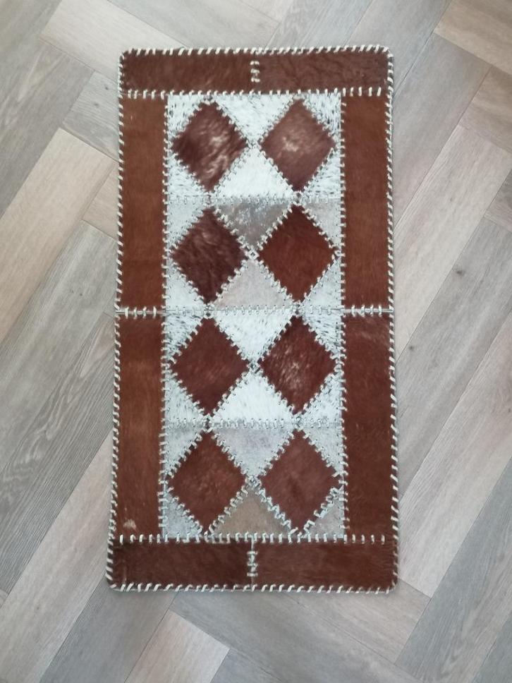 koeienhuid kleed 120 x 61 cm  in goede staat, Antiek en Kunst, Antiek | Kleden en Textiel, Ophalen of Verzenden