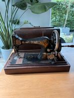 Antieke Singer naaimachine, Ophalen