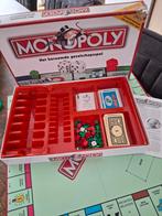 Monopoly het beroemde gezelschapsspel, Hobby en Vrije tijd, Ophalen of Verzenden, Zo goed als nieuw