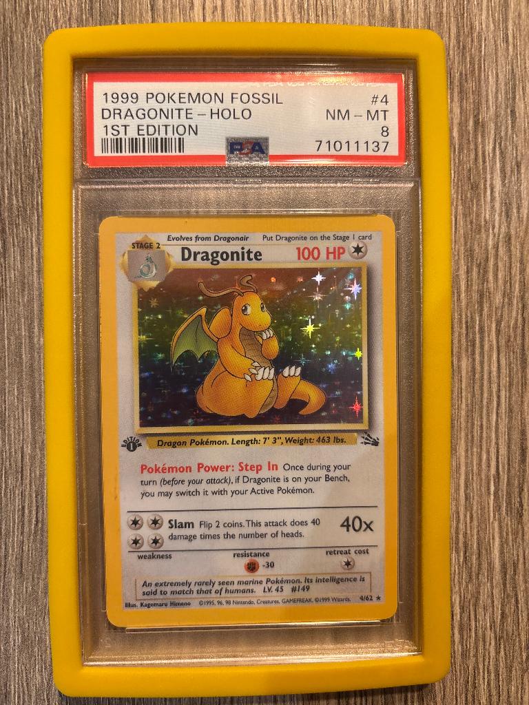 Pokemon Dragonite Holo 1st Edition PSA 8 – Fossil 1999, Ophalen of Verzenden, Zo goed als nieuw, Losse kaart, Foil