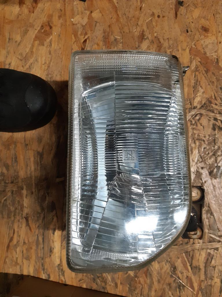 FORD ESCORT MK4  1986- 1989. KOPLAMP H4 RECHTS IZGST, Ophalen of Verzenden, Gebruikt, Universele onderdelen