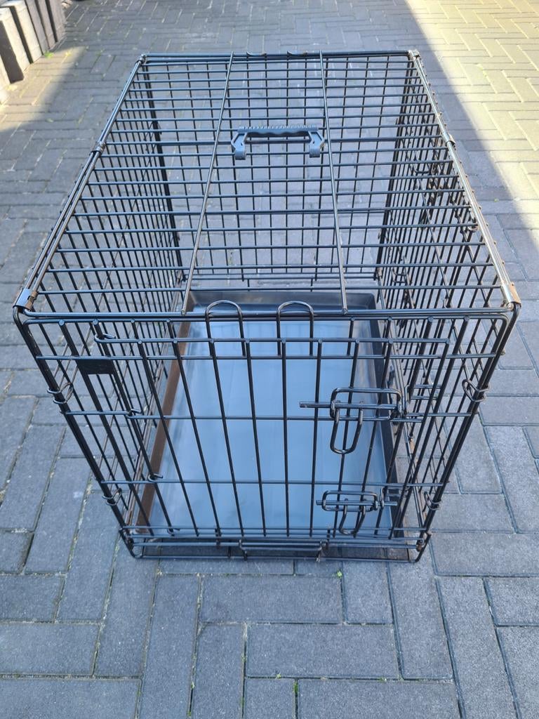 Hondenbench voor een puppy of kleine hond, Ophalen