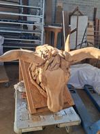 Dierenkop Houtsnijwerk, Ophalen