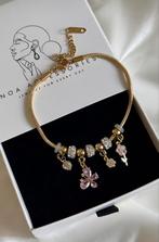 Gouden bedelarmband met roze accenten, Staal, Nieuw, Ophalen of Verzenden, Met bedels of kralen