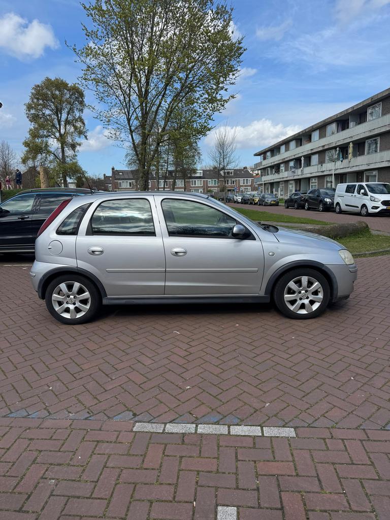 Opel Corsa 1.2 16V Twinport 5D 2006 Grijs, Auto's, Opel, Particulier, Corsa, Benzine, C, Hatchback, Handgeschakeld, Origineel Nederlands