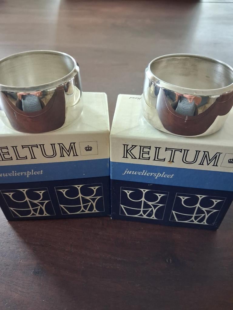 Twee Keltum servetringen in originele verpakking, Antiek en Kunst, Antiek | Bestek, Ophalen