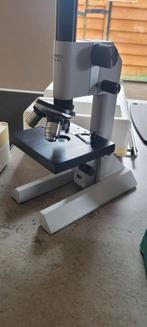 Microscoop met toebehoren, Ophalen