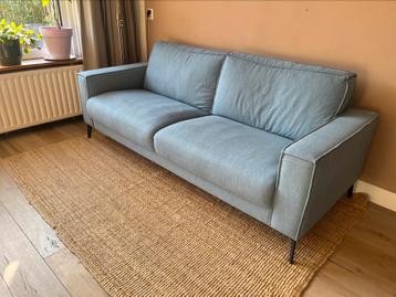Stijlvolle 3 zits bank met hocker