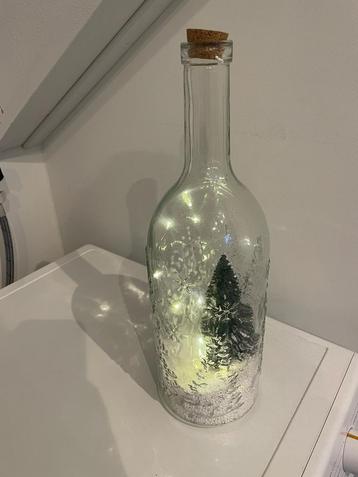 Kerst fles met lampjes, spuitende sneeuw en muziek beschikbaar voor biedingen