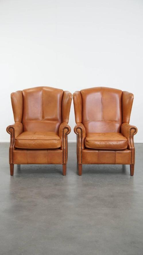 Set van 2 rundleren oorfauteuils afgewerkt met siernagels, Huis en Inrichting, Fauteuils, Gebruikt, 75 tot 100 cm, 75 tot 100 cm
