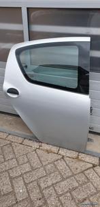 Portier RA Aygo Toyota rechts achter 67113-0H010 KTB passagi