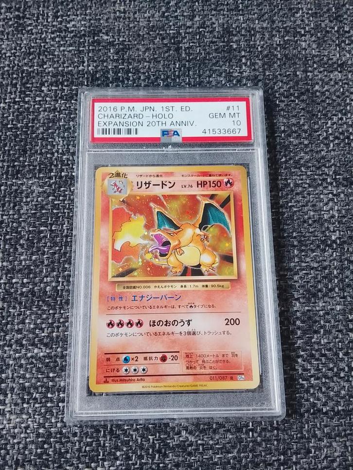 PSA 10 Charizard Holo Japanese 2016, Hobby en Vrije tijd, Verzamelkaartspellen | Pokémon, Zo goed als nieuw, Ophalen of Verzenden