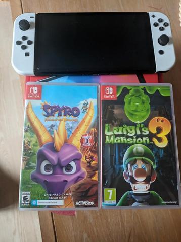 Nintendo switch Oled in box + 2 games  beschikbaar voor biedingen