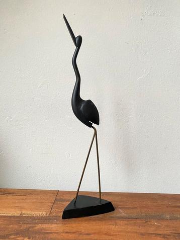 Vintage houten vogel met messing poten beschikbaar voor biedingen