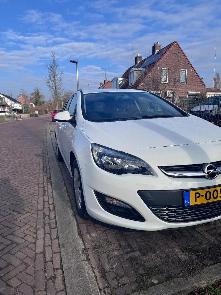 Opel Astra 1.6 Ecotec 115pk 2014 Wit, Auto's, Opel, Particulier, Astra, Benzine, Euro 5, C, Stationwagon, Handgeschakeld, Geïmporteerd