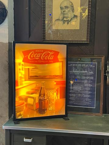 Coca Cola lichtreclame. beschikbaar voor biedingen