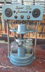 Horlogemakers schoonmaak machine, Ophalen