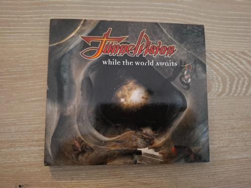 Cd Tunnelvision – While The World Awaits. (1999), Cd's en Dvd's, Cd's | Hardrock en Metal, Zo goed als nieuw, Ophalen of Verzenden