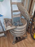 Antieke wasmachine met ijzeren onderstel, Ophalen