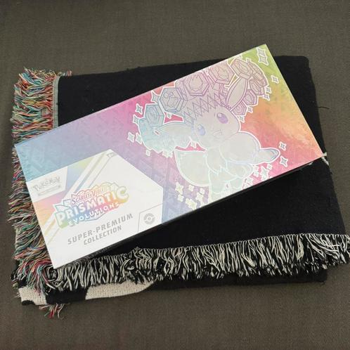 Prismatic Evolutions Super Premium Collection [RUIL], Hobby en Vrije tijd, Verzamelkaartspellen | Pokémon, Nieuw, Ophalen
