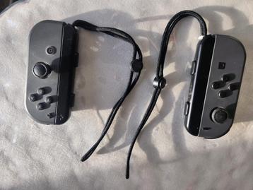 Originele Nintendo Joy-Cons Zwart + Strap beschikbaar voor biedingen