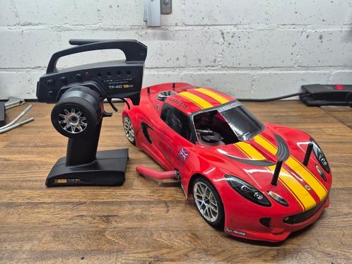 Hpi RS4 nitro lotus met moderne hpi 2.4ghz remote, Hobby en Vrije tijd, Modelbouw | Radiografisch | Auto's, Zo goed als nieuw