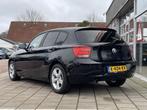 BMW 1-serie 116i High Executive /Automaat/Clima/Stoelverw/Sp, Gebruikt, 4 cilinders, Met garantie (alle), Zwart