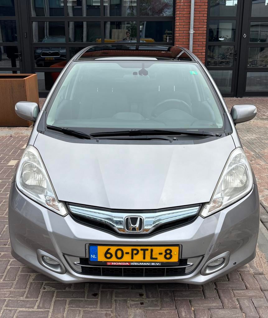 Honda Jazz 1.4i Hybrid Elegance - inclusief fietsendrager, Auto's, Honda, 4 cilinders, 49 €/maand, Origineel Nederlands, Grijs