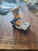Donald Duck in politie auto, Ophalen of Verzenden, Gebruikt