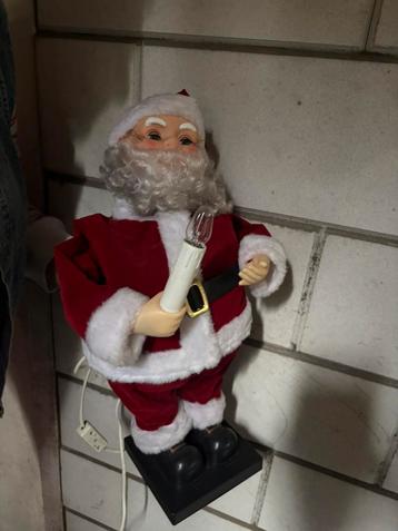 Kerstman klein met lichtgevende kaars beschikbaar voor biedingen