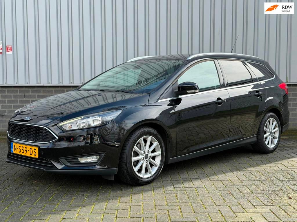 Ford Focus Wagon 1.0 Titanium |Navi|CruiseCtrl|PDC|Stuur/Sto, Gebruikt, Zwart, Handgeschakeld, 1216 kg