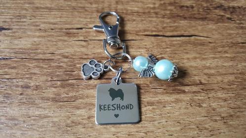 Tashanger / Sleutelhanger Keeshond RVS met beschermengeltje, Sieraden, Tassen en Uiterlijk, Tassen | Damestassen, Nieuw, Verzenden