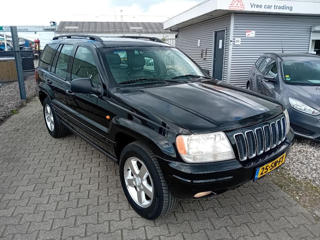 Jeep Grand Cherokee 4.0 I AUT BJ2001 LPG! NIEUWE APK!, Automaat, Zwart, Met garantie (alle), 3360 kg