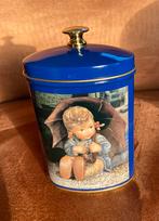 Een blauw Hûmmel blikje met meisje onder paraplu, Verzamelen, Ophalen of Verzenden, Gebruikt, Overige