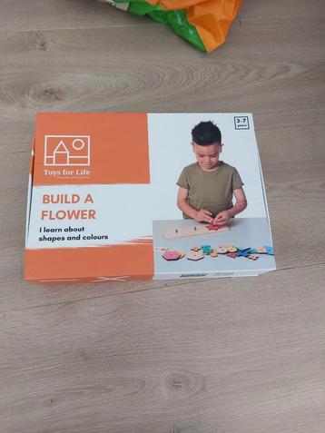 Build a flower beschikbaar voor biedingen