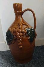 Aardewerk kruik met versiering, Ophalen