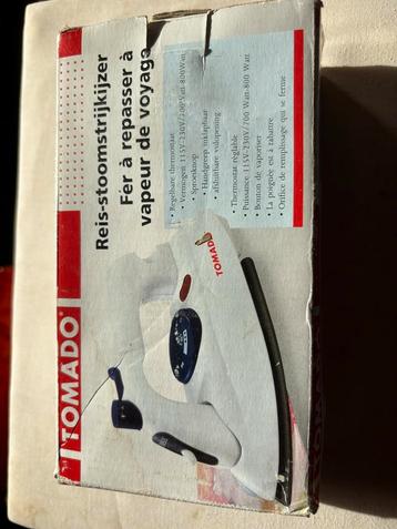 Reis strijkijzer en strijkplank beschikbaar voor biedingen