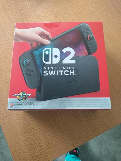 Nintendo Switch 2 + Mario Kart World, Spelcomputers en Games, Spelcomputers | Nintendo Switch Lite, Zo goed als nieuw, Roze of Coral
