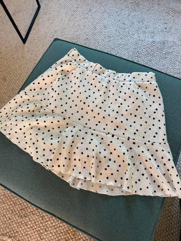 Wit rokje met zwarte stipjes 36/38 (L) beschikbaar voor biedingen