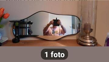 Aangeboden super mooie organischespiegel met zwarte rand. beschikbaar voor biedingen